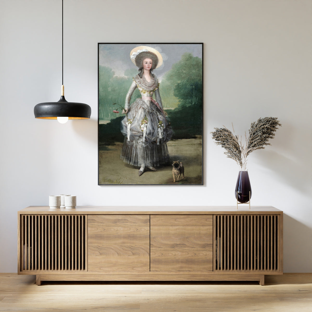 Framed art print of The Marquesa de Pontejos by Francisco de Goya, above a slatted wood sideboard