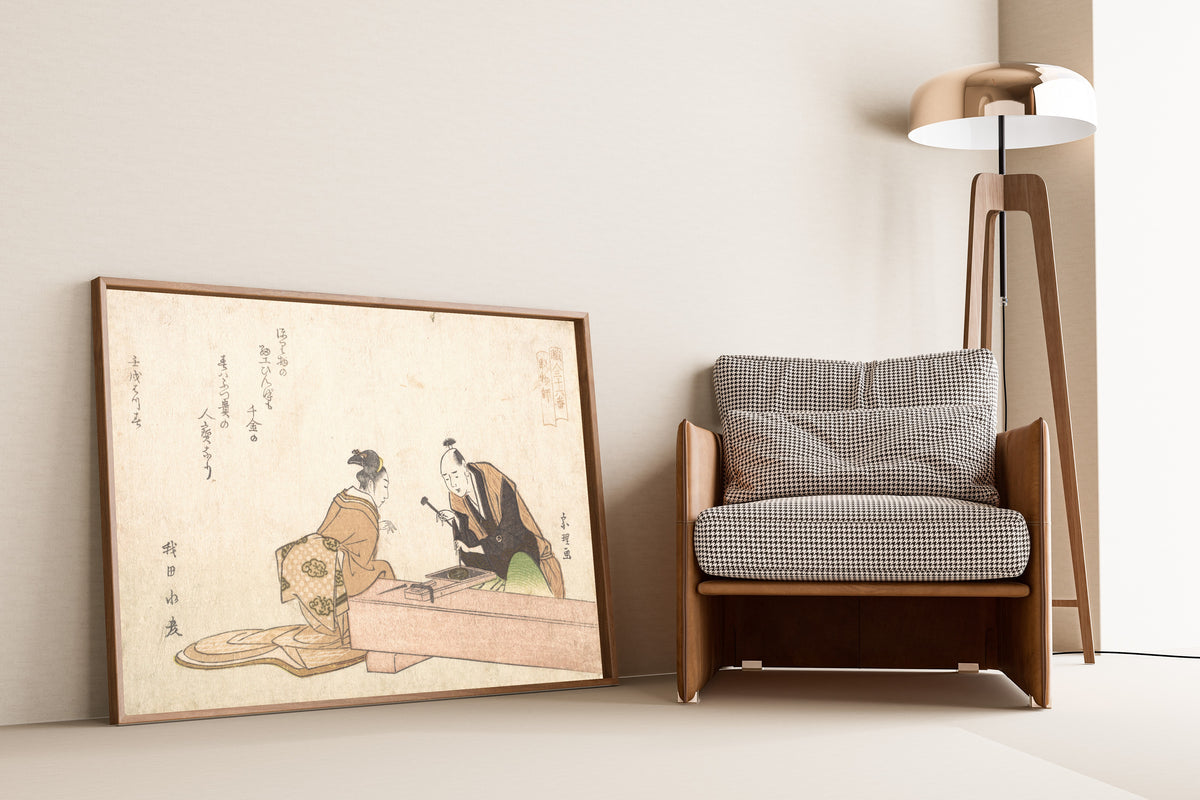 Framed art print of The Metal Carver by Katsushika Hokusai, leaning against a wall beside an armchair and a floor lamp