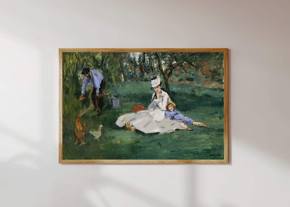 Framed art print of The Monet Family in Their Garden at Argenteuil by Édouard Manet, in a light wood frame on a sunlit white wall