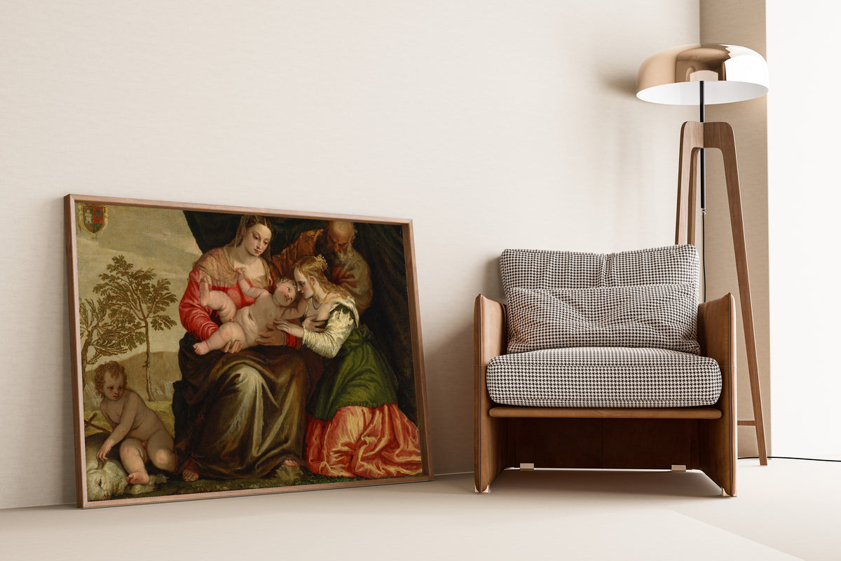 Framed art print of The Mystic Marriage of St. Catherine by Paolo Veronese, leaning against a wall beside an armchair and a floor lamp