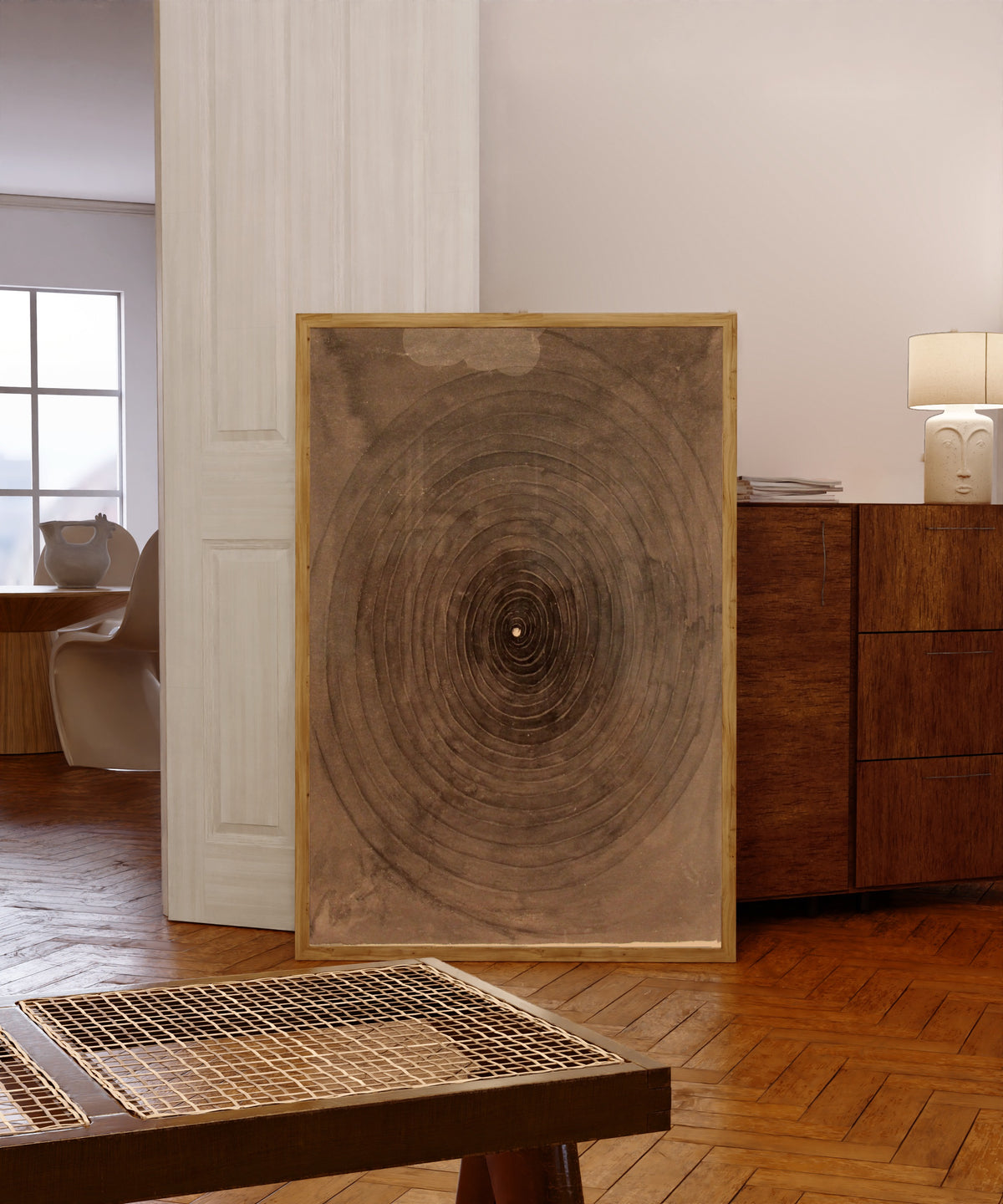 Framed art print of The Parsifal Series, No. 1 by Hilma af Klint, in a light wood frame leaning in a warm room with a parquet floor