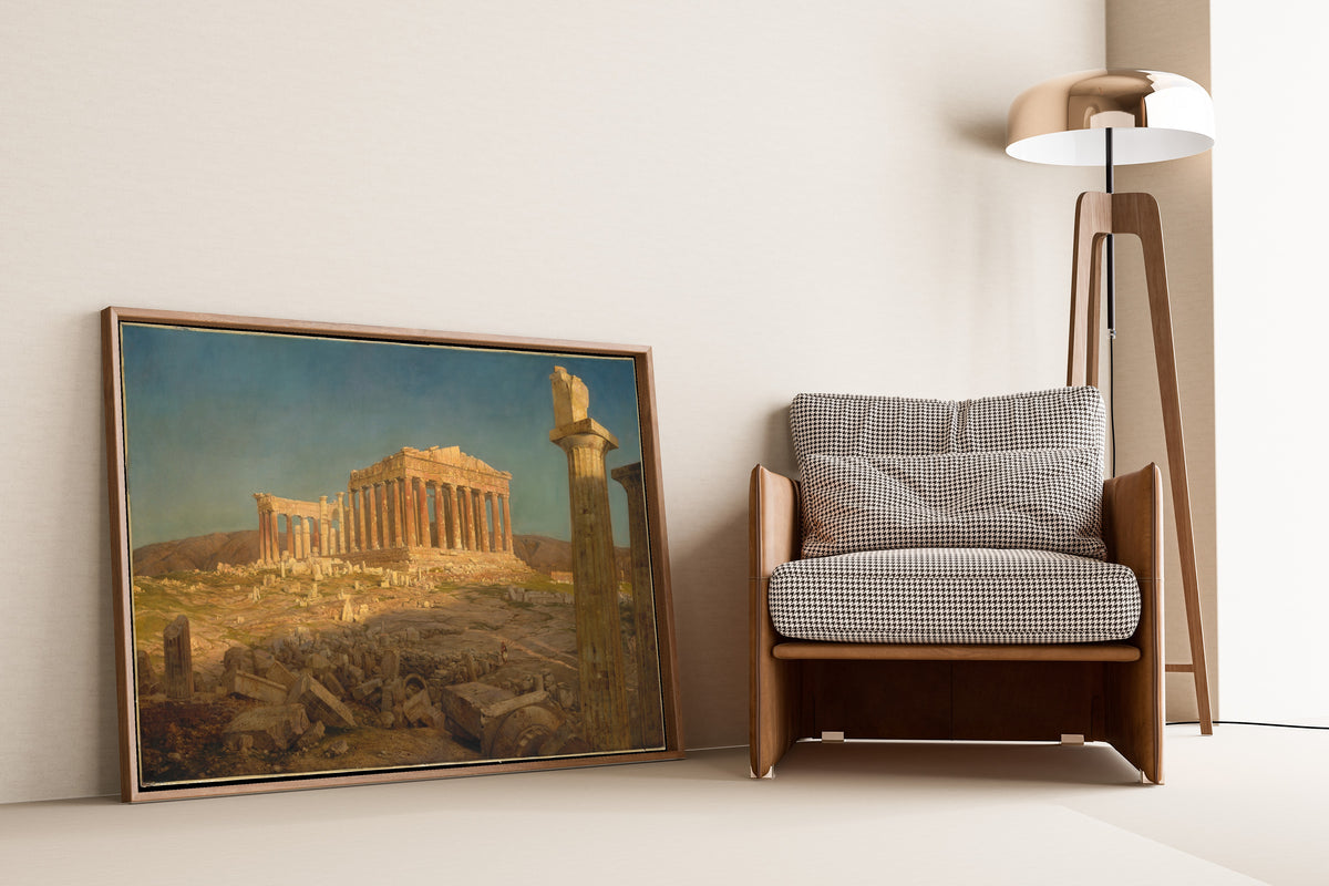 The Parthenon by Frederic Edwin Church — framed and leaning against a wall beside an armchair and a floor lamp