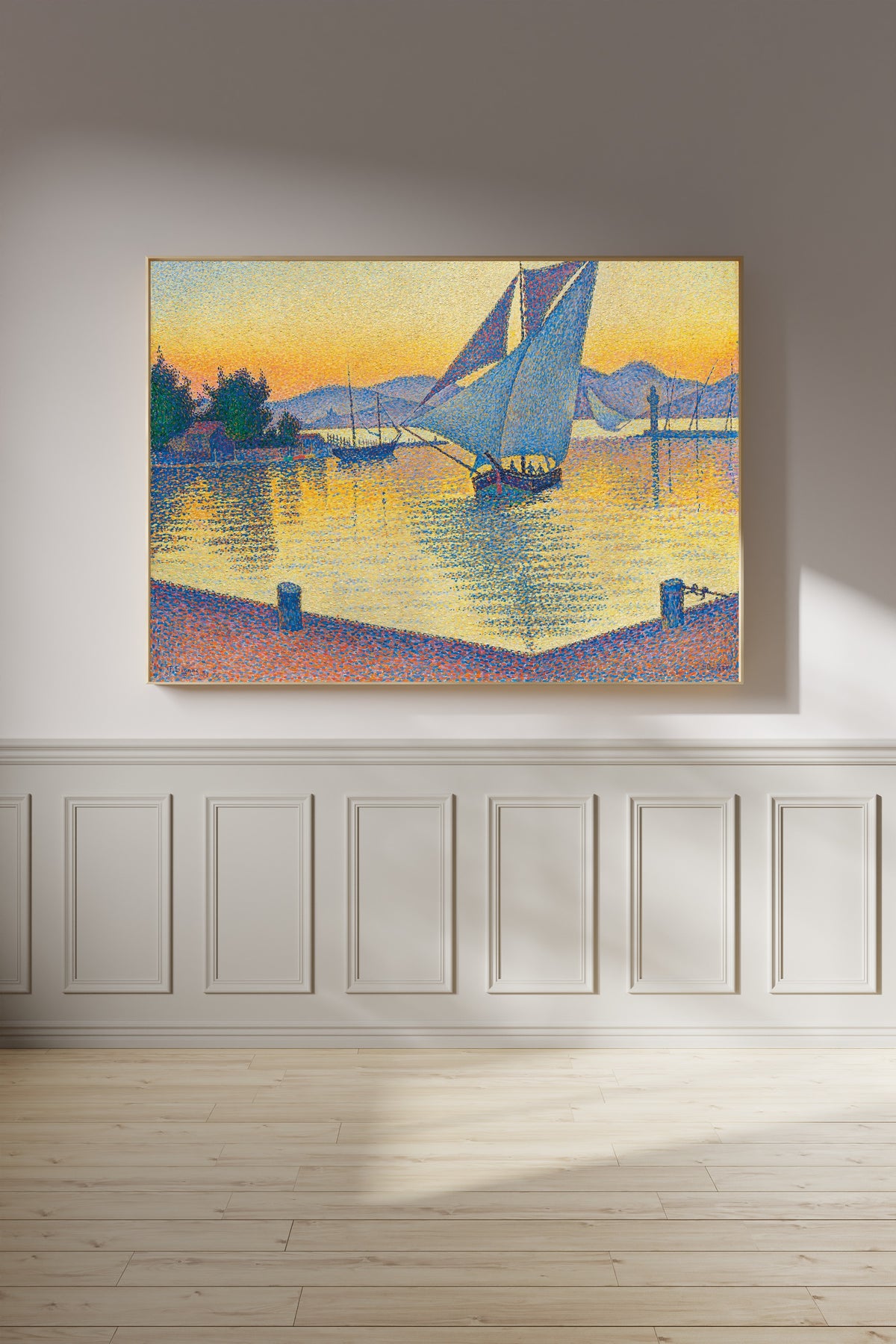 Framed art print of The Port at Sunset, Opus 236, Saint-Tropez by Paul Signac, on a panelled wall in afternoon light