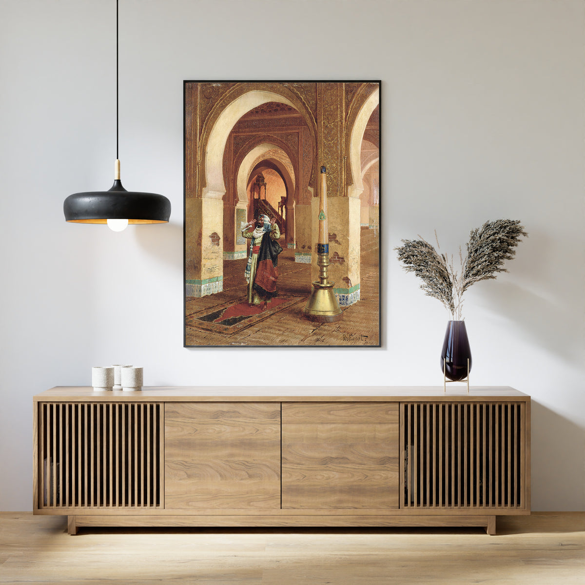 Framed art print of The Prayer by Rudolf Ernst, above a slatted wood sideboard