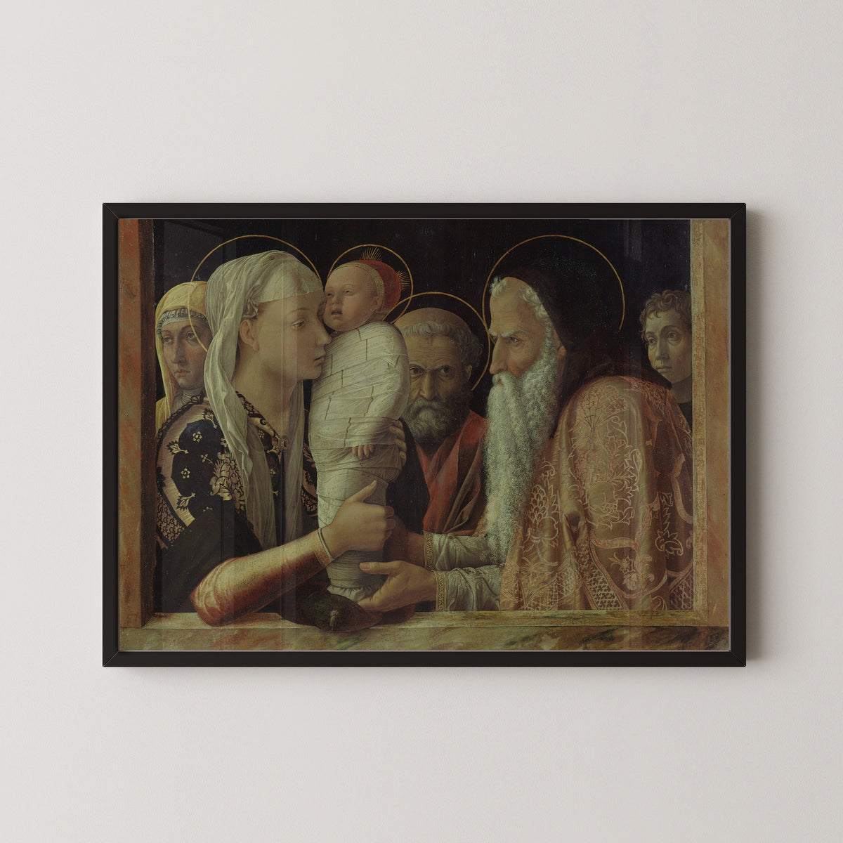 Framed art print of The Presentation by Andrea Mantegna, in a black frame on a pale wall