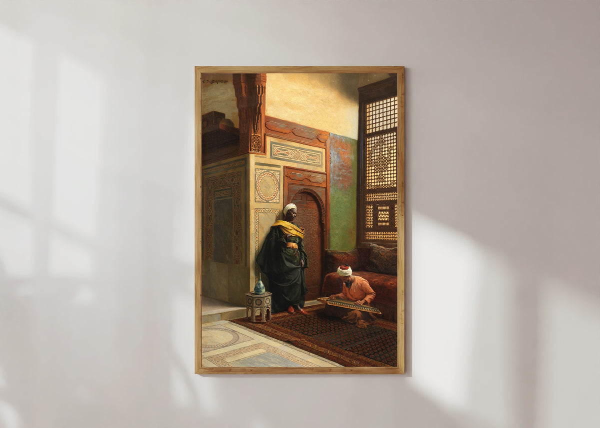 Framed art print of The Qanun Player by Ludwig Deutsch, in a light wood frame on a sunlit white wall