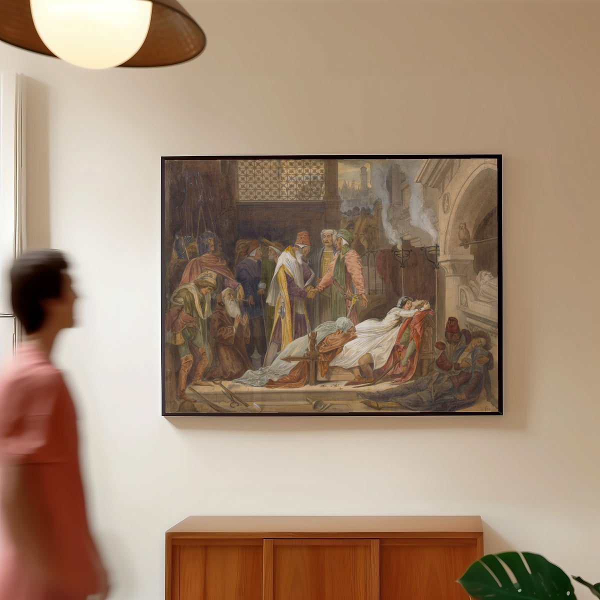 Framed art print of The Reconciliation of the Montagues and the Capulets by Frederic Leighton, in a slim black frame on a warm wall in a sunlit room