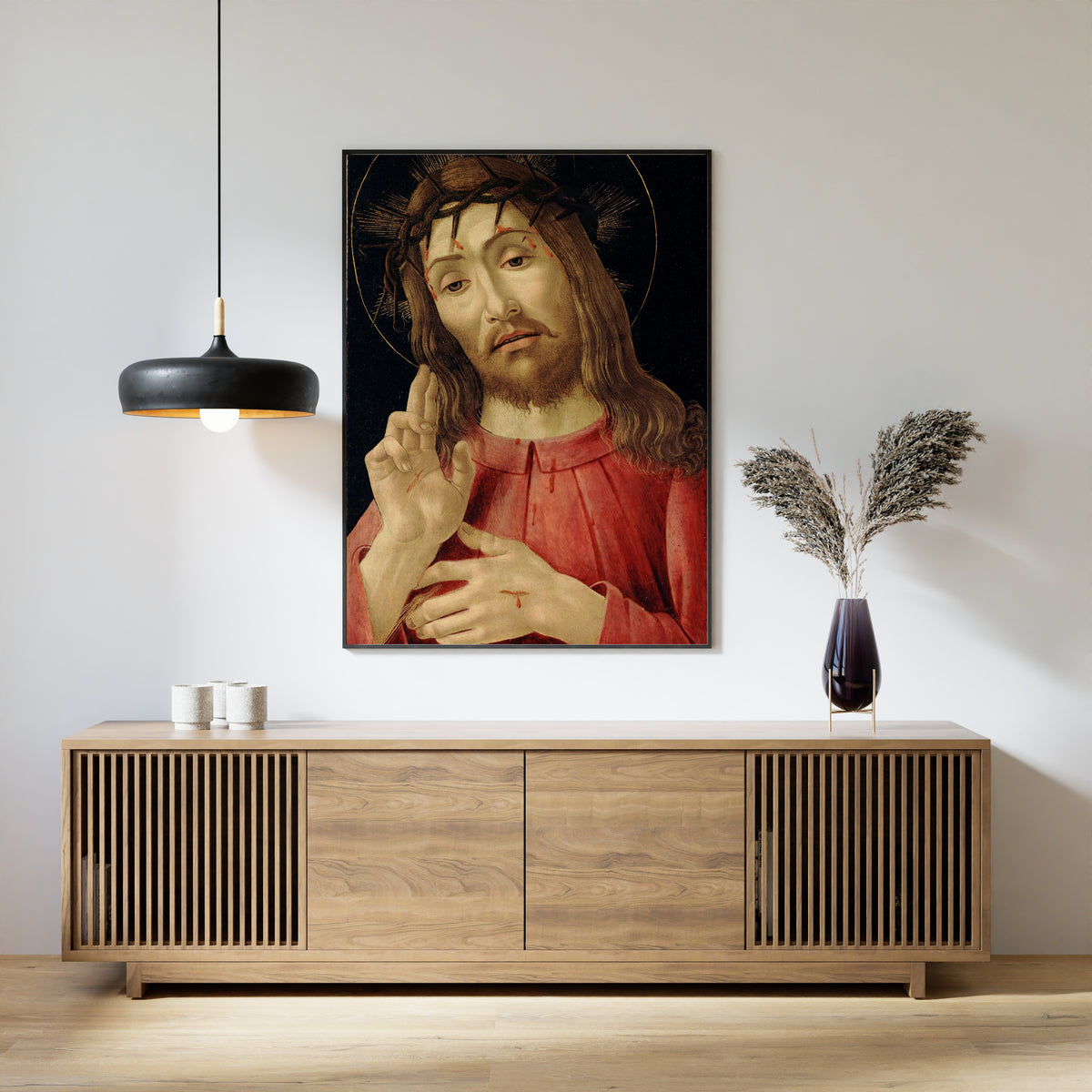 Framed art print of The Resurrected Christ by Sandro Botticelli, above a slatted wood sideboard