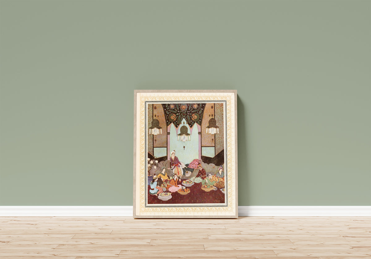 Framed art print of The Room of the Fruits Prepared for Abu-l-Hasan by Edmund Dulac, in a light wood frame leaning on a sage green wall above a wooden floor