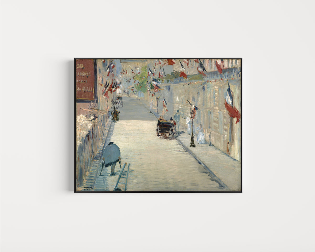 Framed art print of The Rue Mosnier with Flags by Édouard Manet, in a slim black frame on a plain white wall