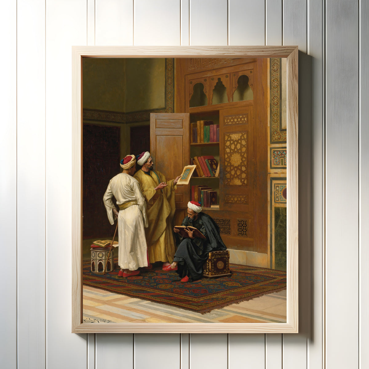 Framed art print of The Scholars by Ludwig Deutsch, in a light wood frame on a white panelled wall