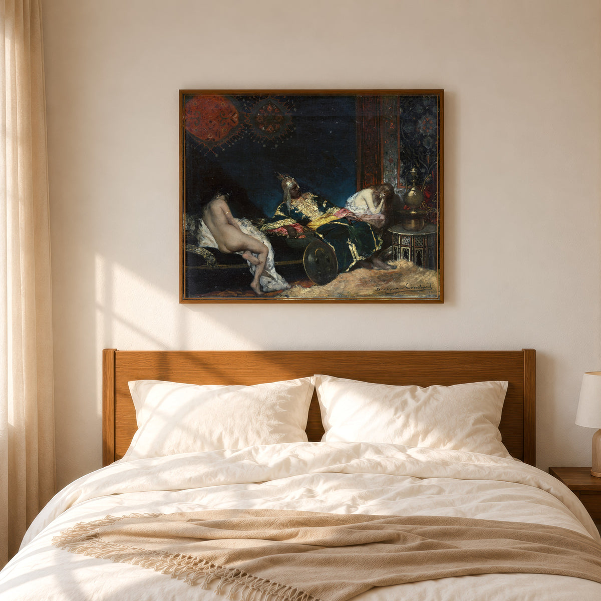 Framed art print of The Serbian Concubine by Jean-Joseph Benjamin-Constant, in a slim wood frame above a bed in a sunlit bedroom