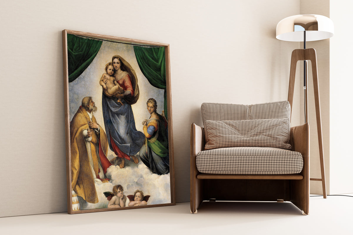 Framed art print of The Sistine Madonna by Raphael, leaning against a wall beside an armchair and a floor lamp