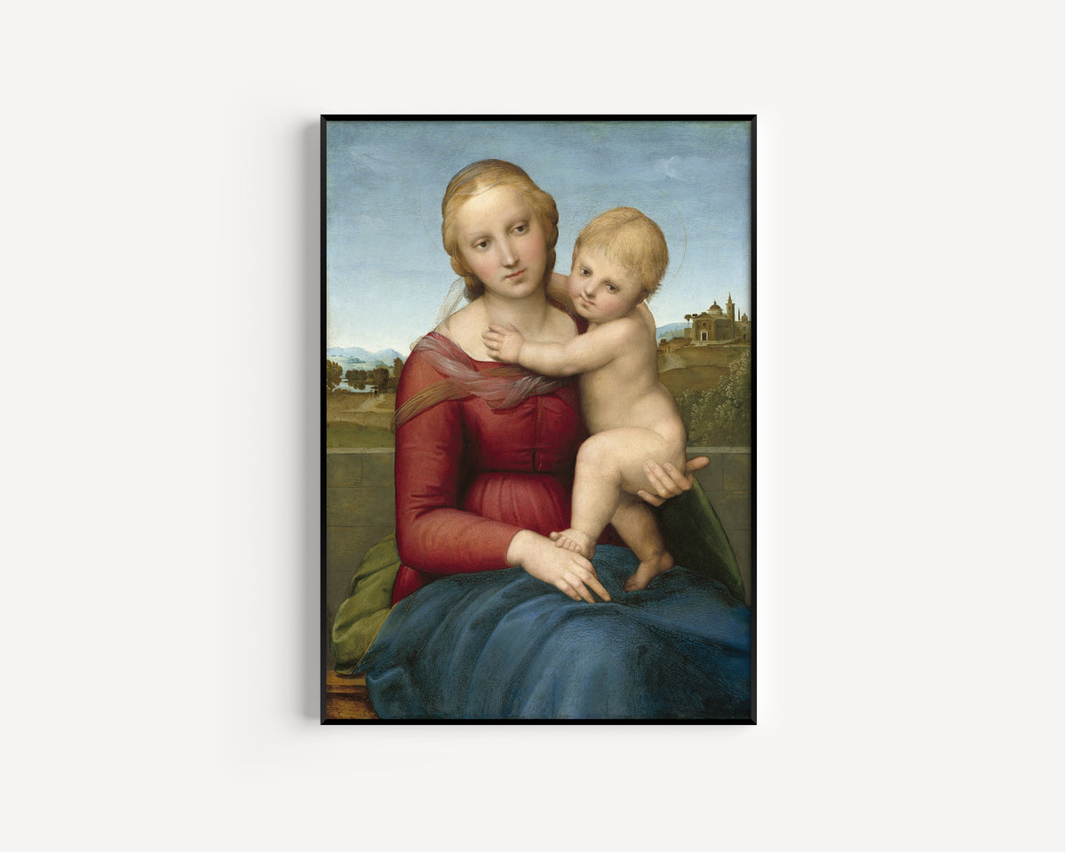 Framed art print of The Small Cowper Madonna by Raphael, in a slim black frame on a plain white wall