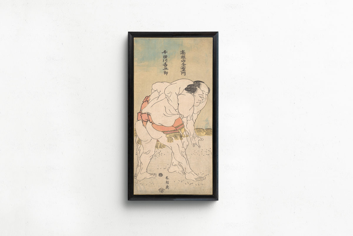 Framed art print of The Sumo Wrestlers Takaneyama Yoichiemon and Sendagawa Kichigorō by Katsushika Hokusai, in a slim black frame on a plain white wall