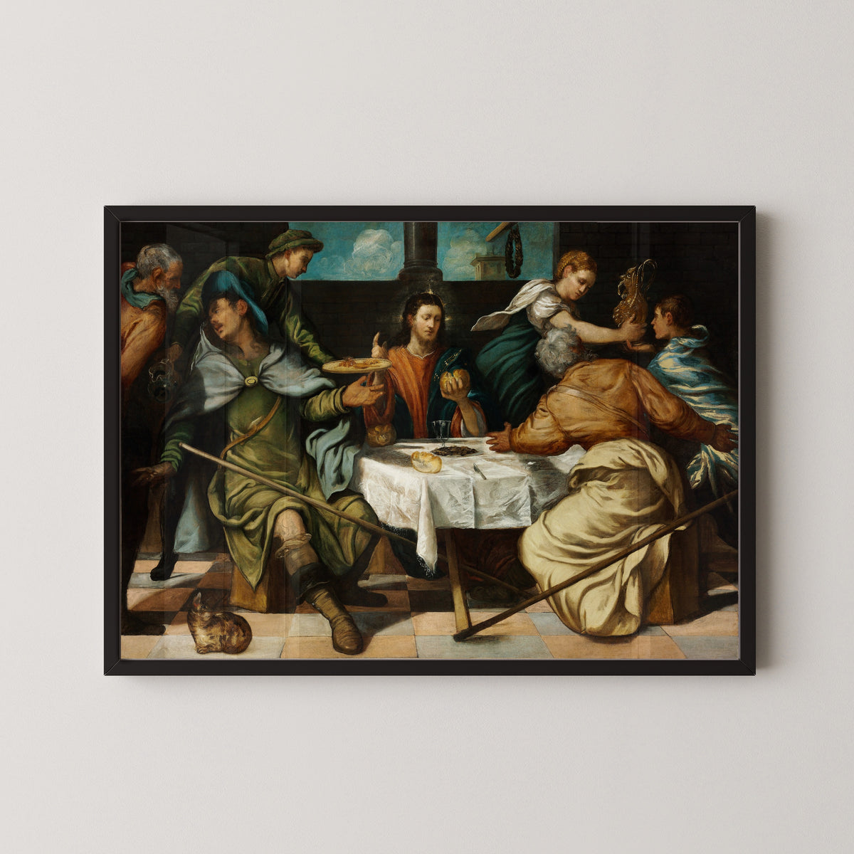Framed art print of The Supper at Emmaus by Tintoretto, in a black frame on a pale wall
