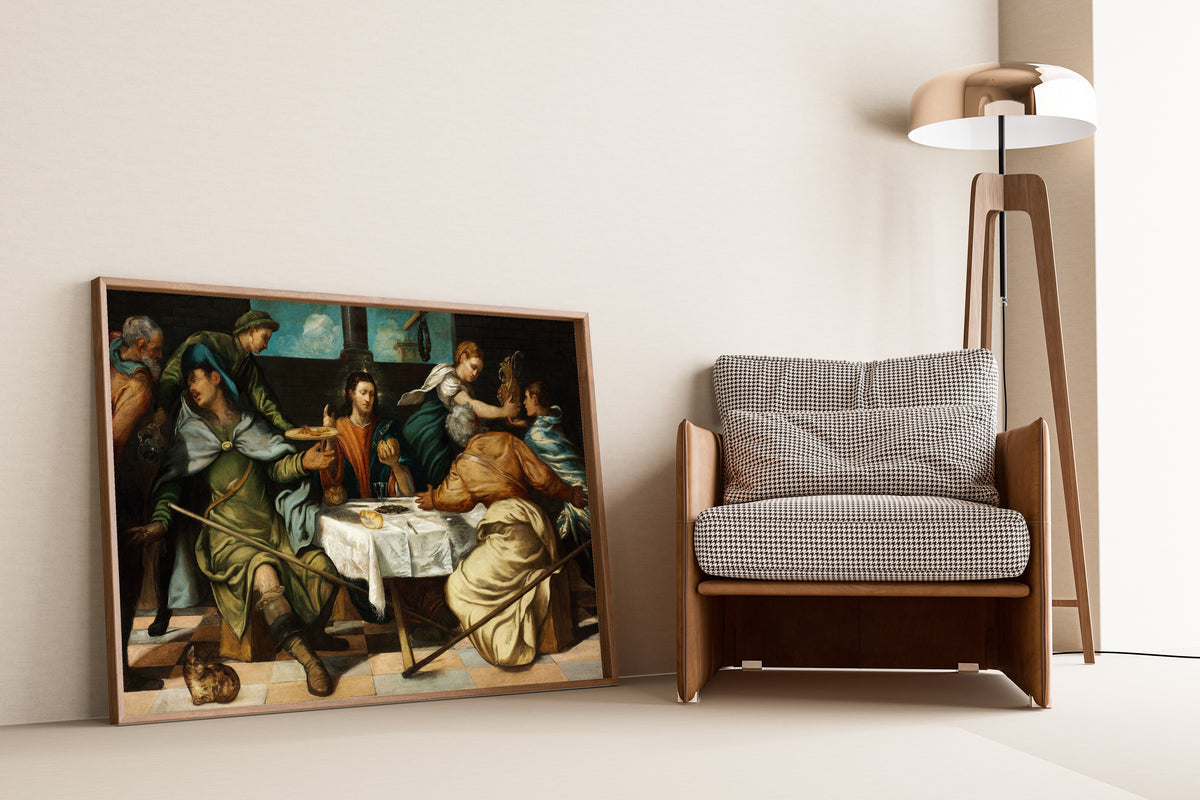 Framed art print of The Supper at Emmaus by Tintoretto, leaning against a wall beside an armchair and a floor lamp