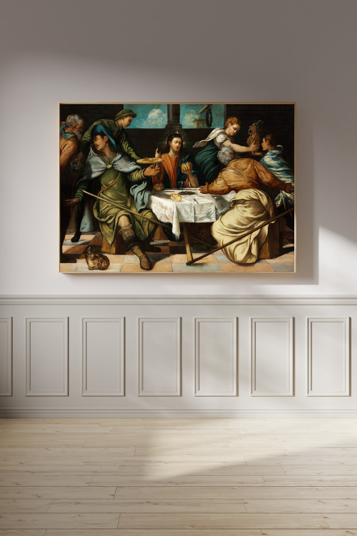 Framed art print of The Supper at Emmaus by Tintoretto, on a panelled wall in afternoon light