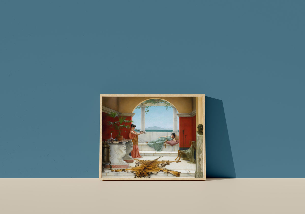 Framed art print of The Sweet Siesta of a Summer Day by John William Godward, in a light wood frame leaning on a blue wall