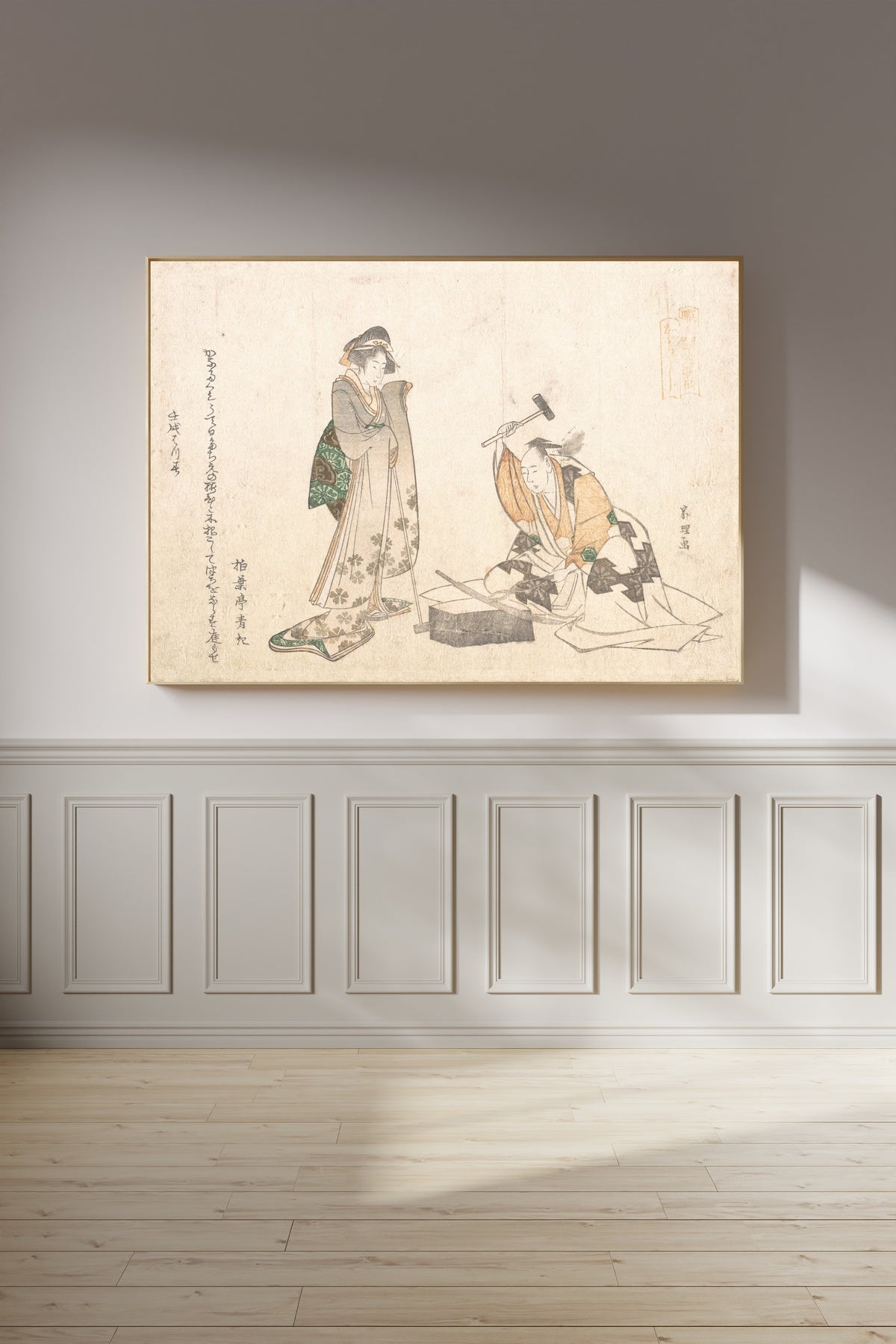 Framed art print of The Swordsmith by Katsushika Hokusai, on a panelled wall in afternoon light