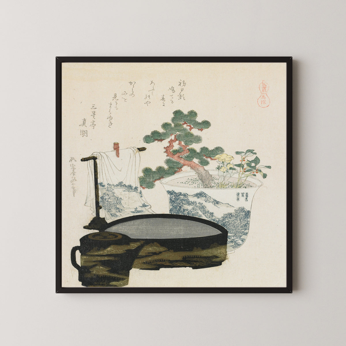 Framed art print of The Talisman by Katsushika Hokusai, in a black frame on a pale wall