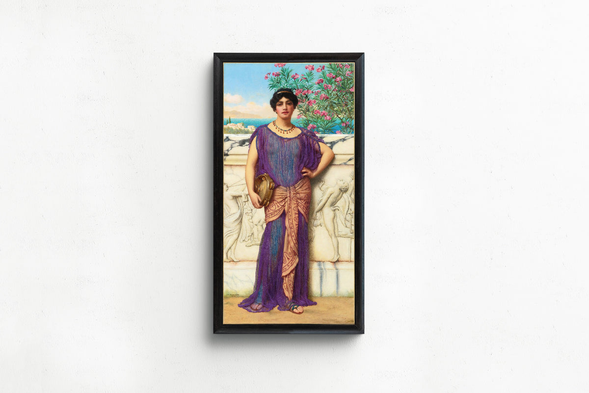 Framed art print of The Tambourine Girl by John William Godward, in a slim black frame on a plain white wall