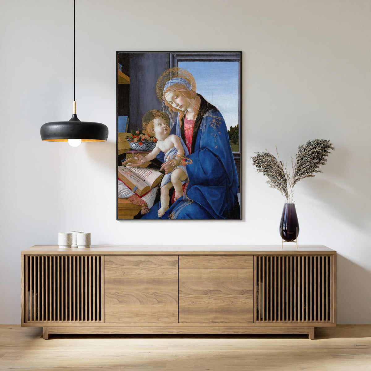 Framed art print of The Virgin and Child (The Madonna of the Book) by Sandro Botticelli, above a slatted wood sideboard