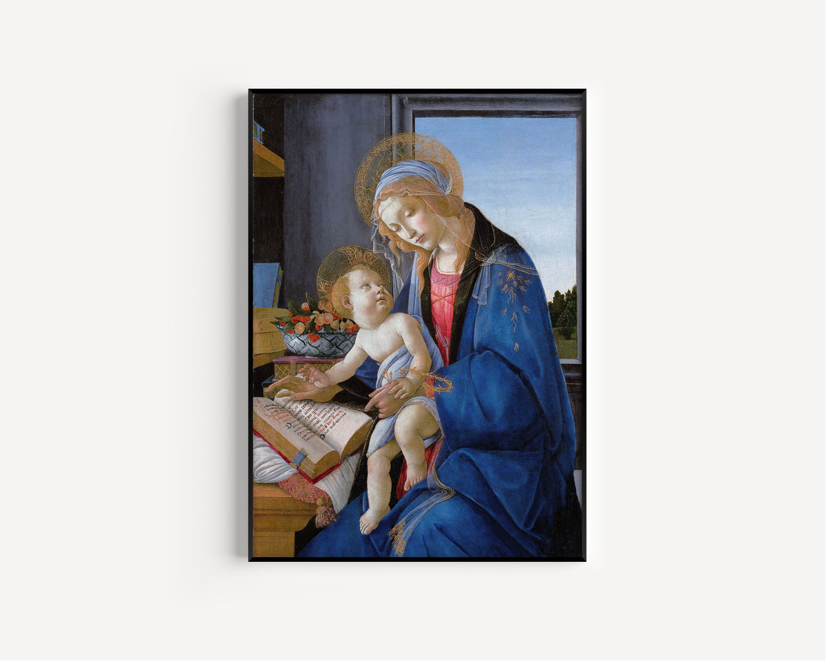 Framed art print of The Virgin and Child (The Madonna of the Book) by Sandro Botticelli, in a slim black frame on a plain white wall