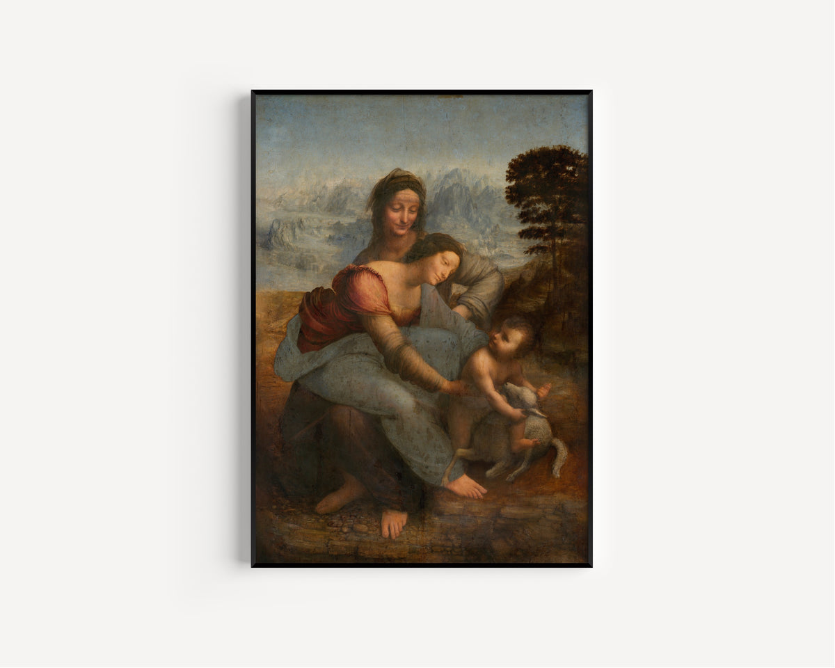 Framed art print of The Virgin and Child with St. Anne by Leonardo da Vinci, in a slim black frame on a plain white wall