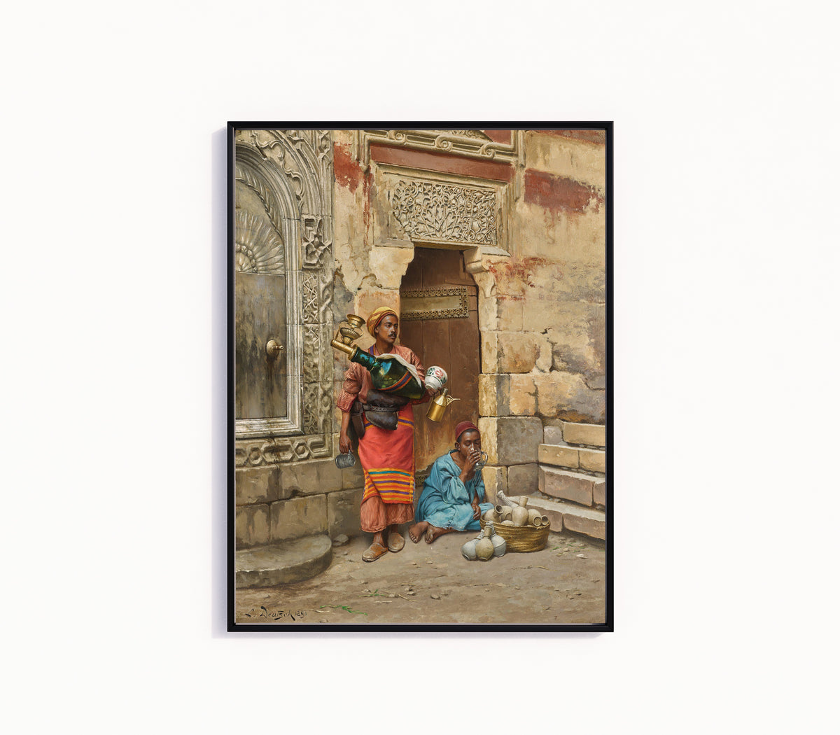 Framed art print of The Water Seller by Ludwig Deutsch, in a slim black frame on a plain white wall