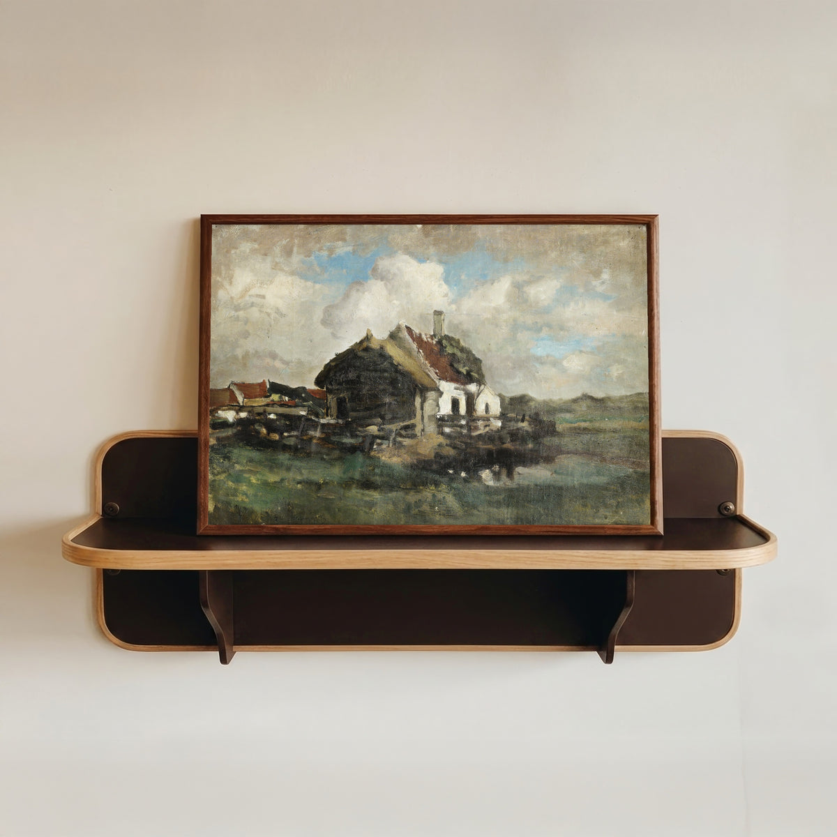 Framed art print of The abandoned house by Félicien Rops, in a dark wood frame resting on a wall shelf