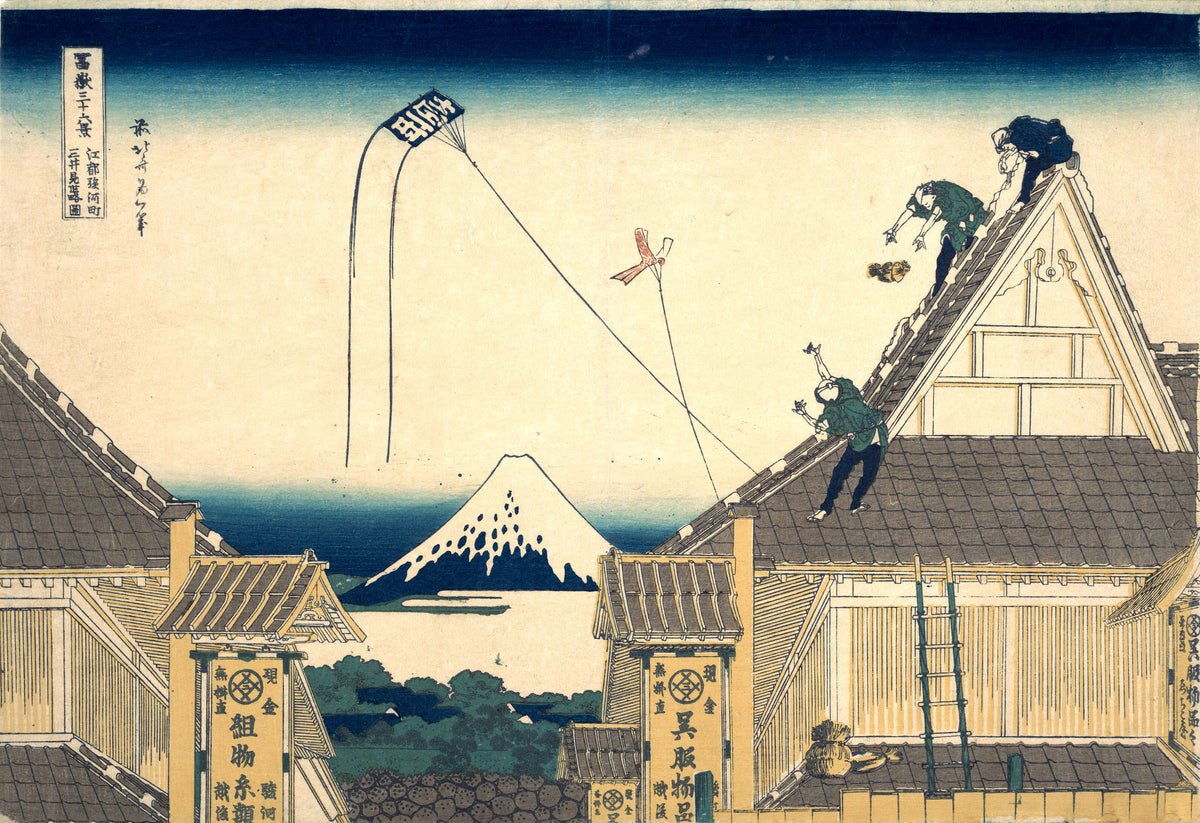 Thirty-six Views of Mount Fuji: Mitsui Shop at Surugachō in Edo by Katsushika Hokusai — Roofers and kites over the Mitsui shop roofs, with Fuji beyond