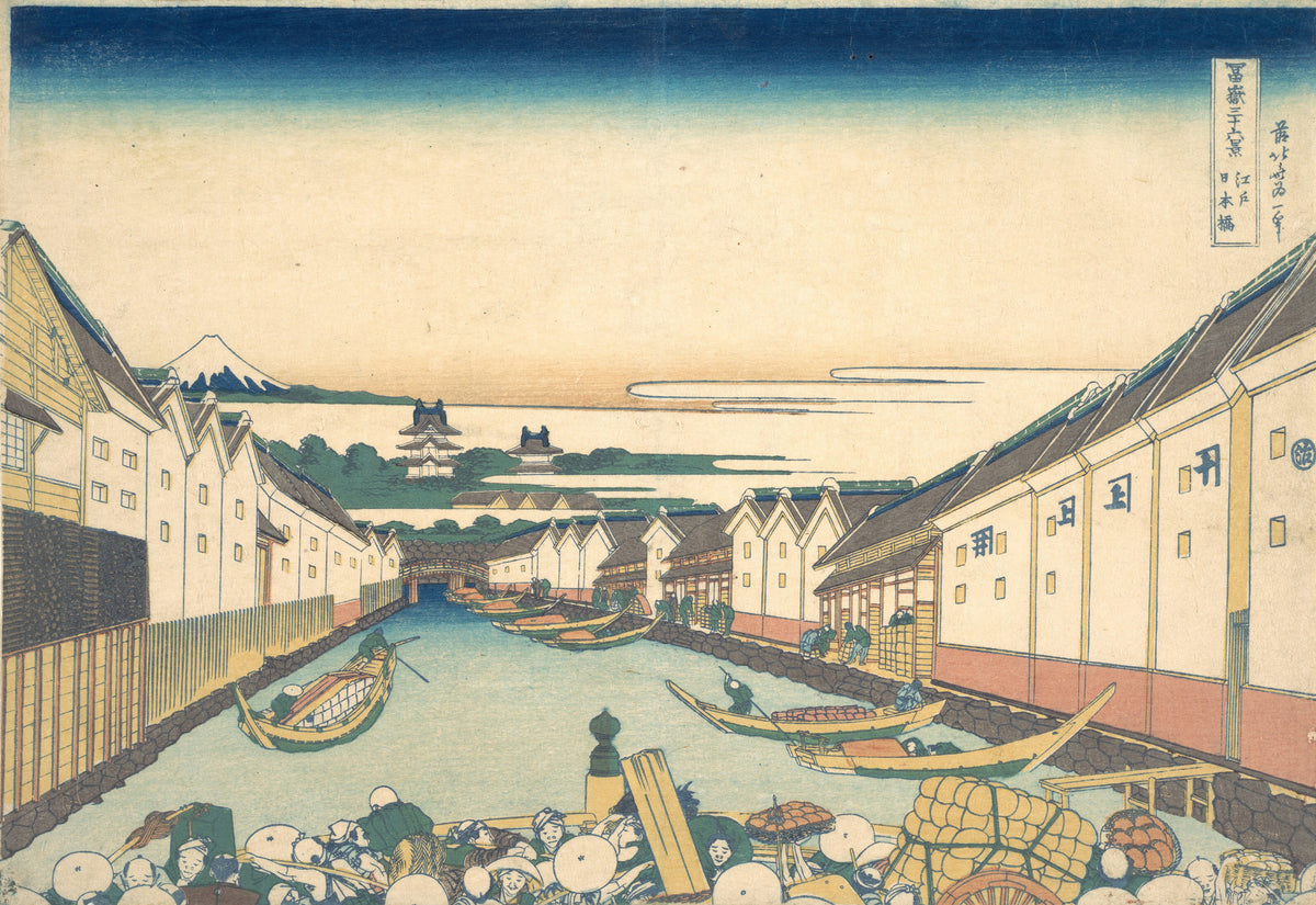 Thirty-six Views of Mount Fuji: Nihonbashi in Edo by Katsushika Hokusai — A canal between white warehouses runs toward a castle and Fuji