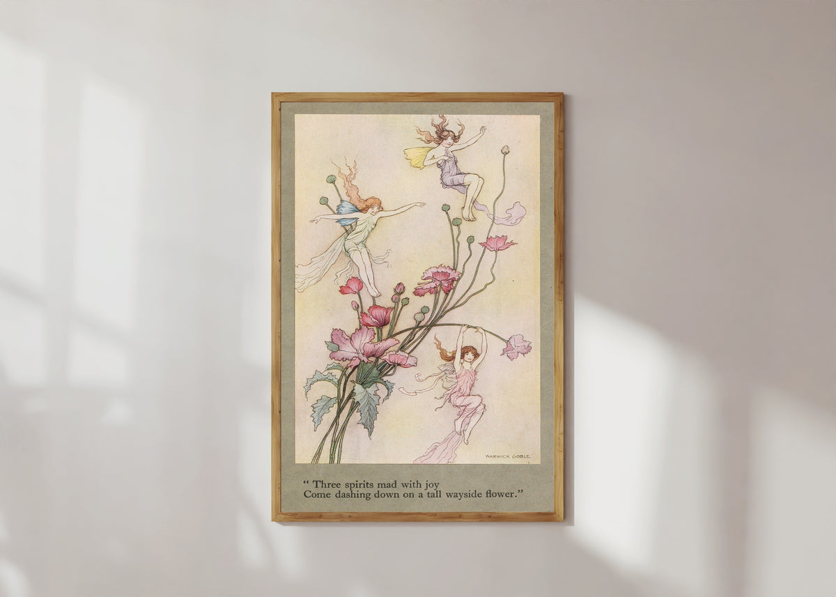 Framed art print of Three spirits mad with joy come dashing down on a tall wayside flower. by Warwick Goble, in a light wood frame on a sunlit white wall