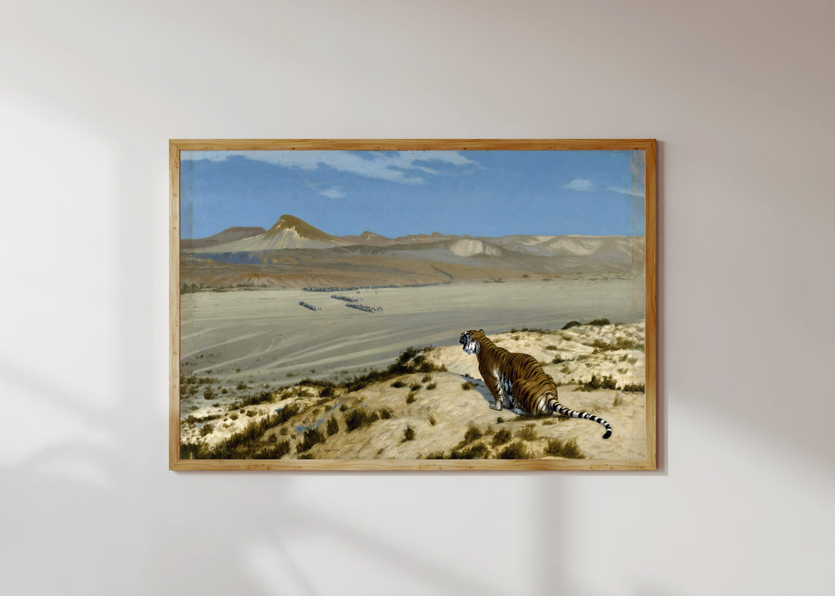 Framed art print of Tiger on the Watch by Jean-Léon Gérôme, in a light wood frame on a sunlit white wall