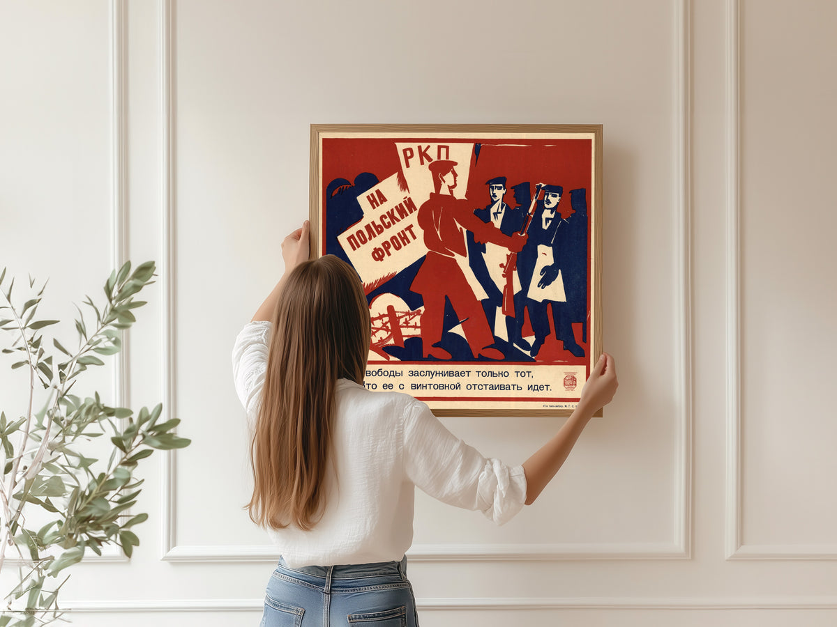Framed art print of To the Polish front: only he deserves freedom who goes to defend it with a rifle by Ivan Malyutin, hung on a panelled wall