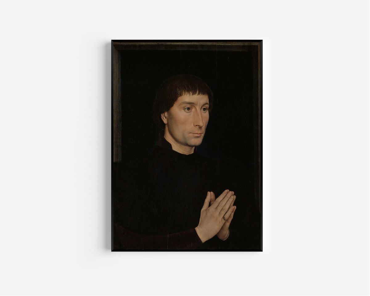 Framed art print of Tommaso di Folco Portinari by Hans Memling, in a slim black frame on a plain white wall