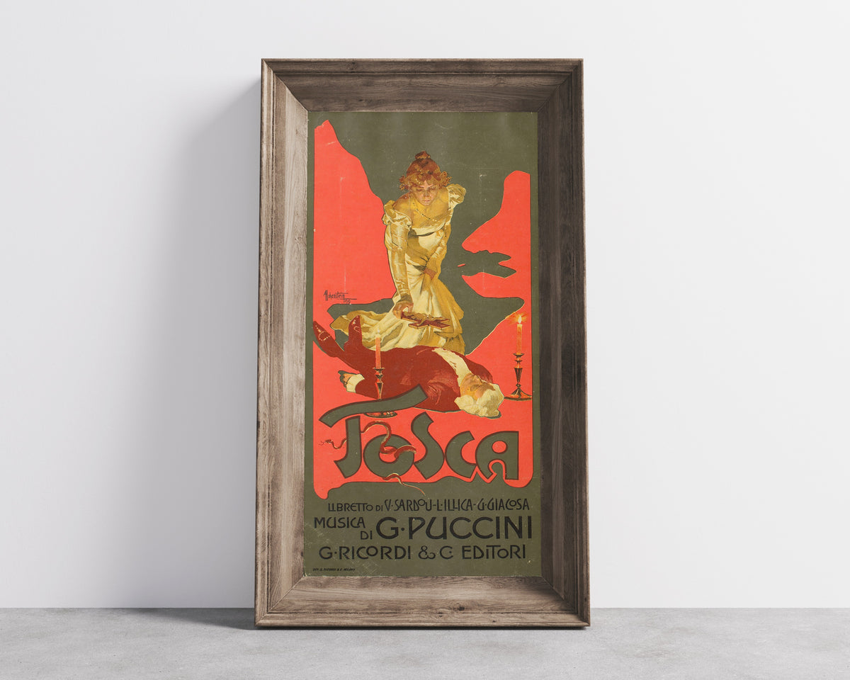 Framed art print of Tosca by Adolfo Hohenstein, in a wide wooden frame leaning against a concrete wall