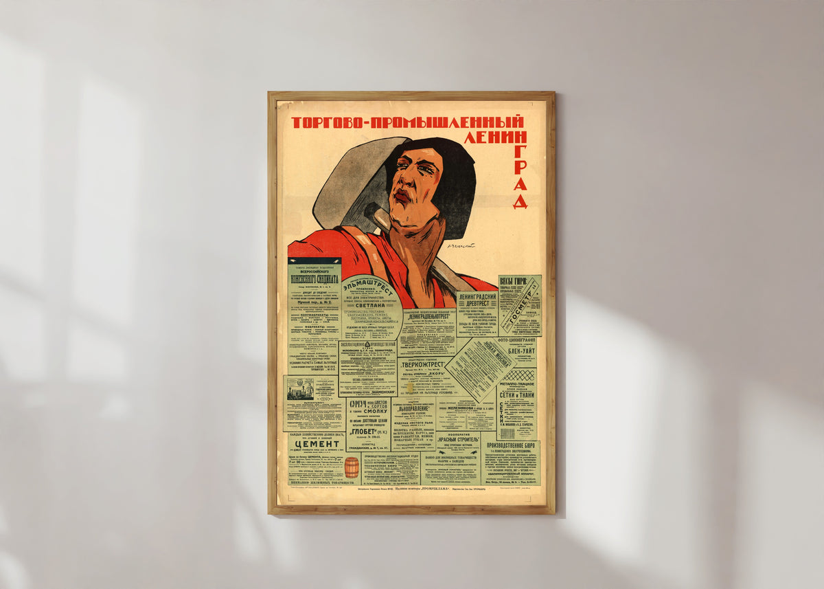 Framed art print of Trade and Industrial Leningrad by Alexander Zelensky, in a light wood frame on a sunlit white wall