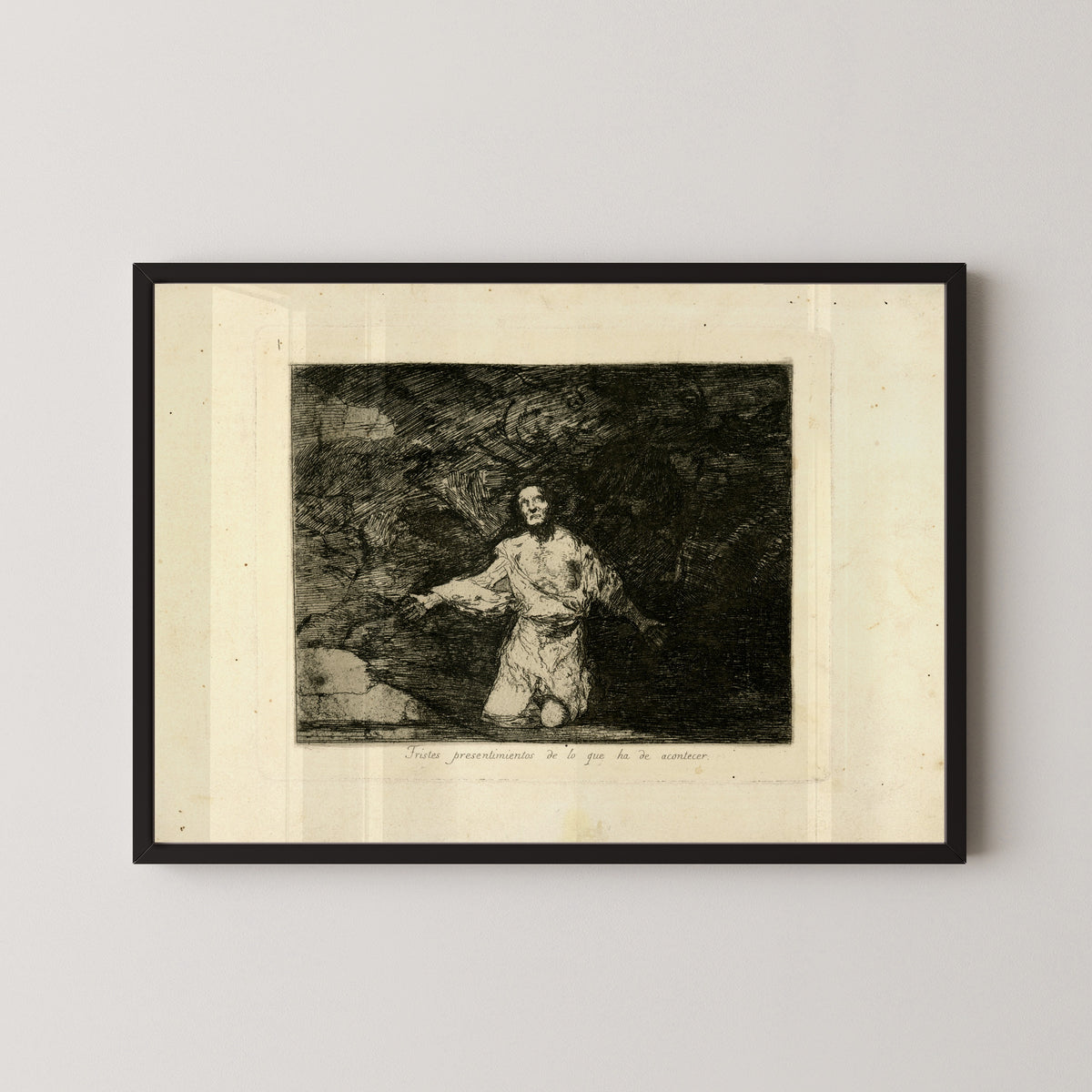 Framed art print of Tristes presentimientos de lo que ha de acontecer (Sad Forebodings of What Is Going… by Francisco de Goya, in a black frame on a pale wall