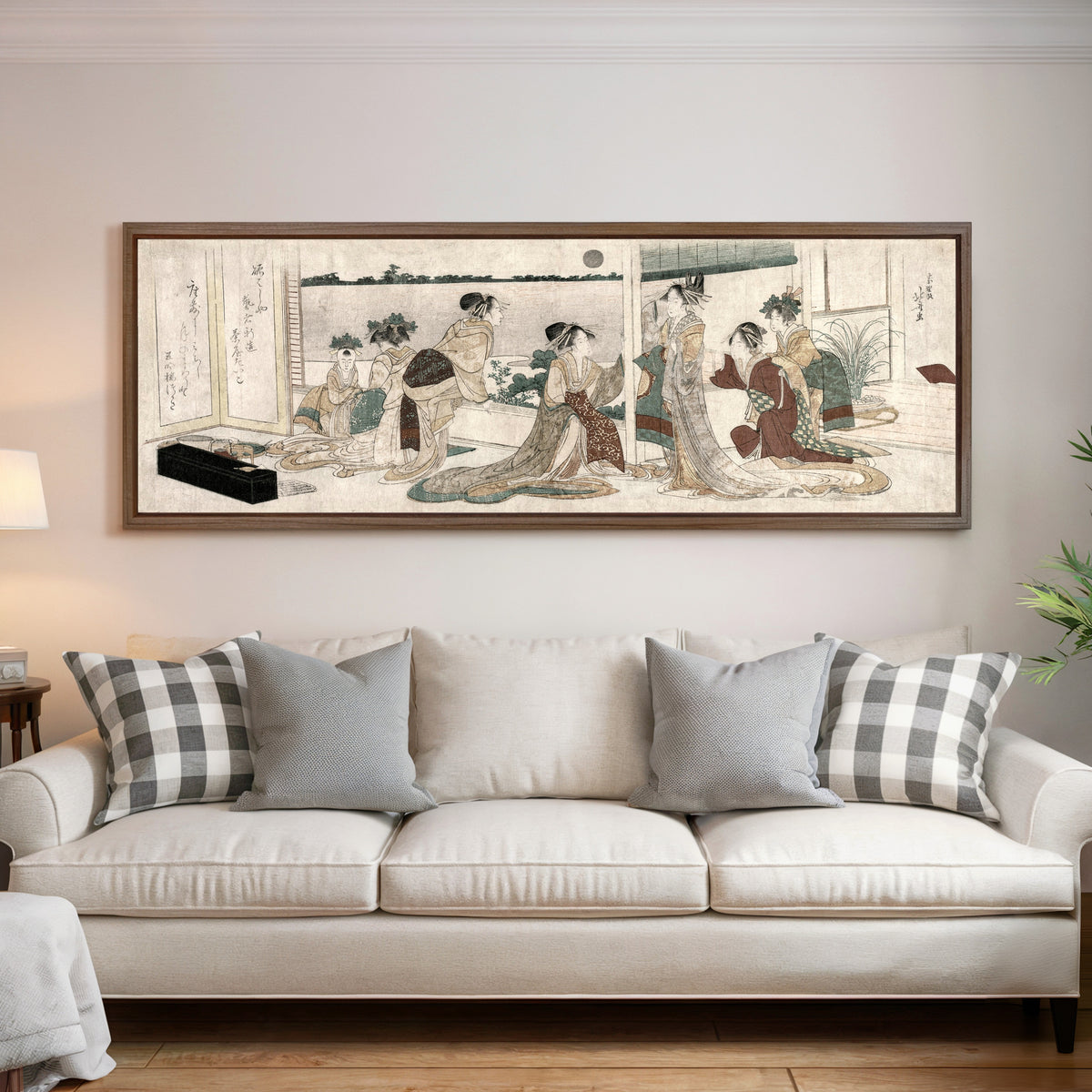 Framed art print of Tsukasa and Other Courtesans of the Ogiya Watching the Autumn Moon Rise Over Rice Fields from a… by Katsushika Hokusai, above a cream sofa