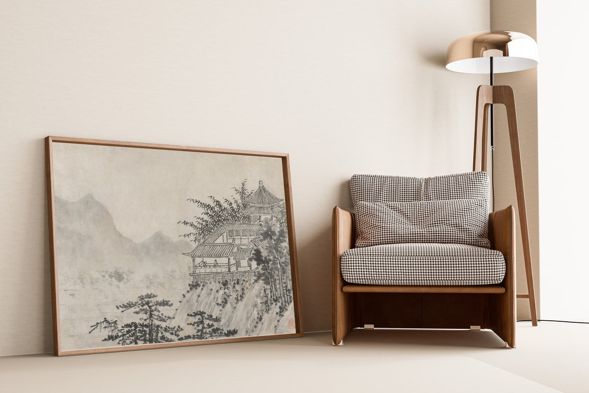 Framed art print of Twelve Views of Tiger Hill: The Thousand Acres of Clouds by Shen Zhou, leaning against a wall beside an armchair and a floor lamp