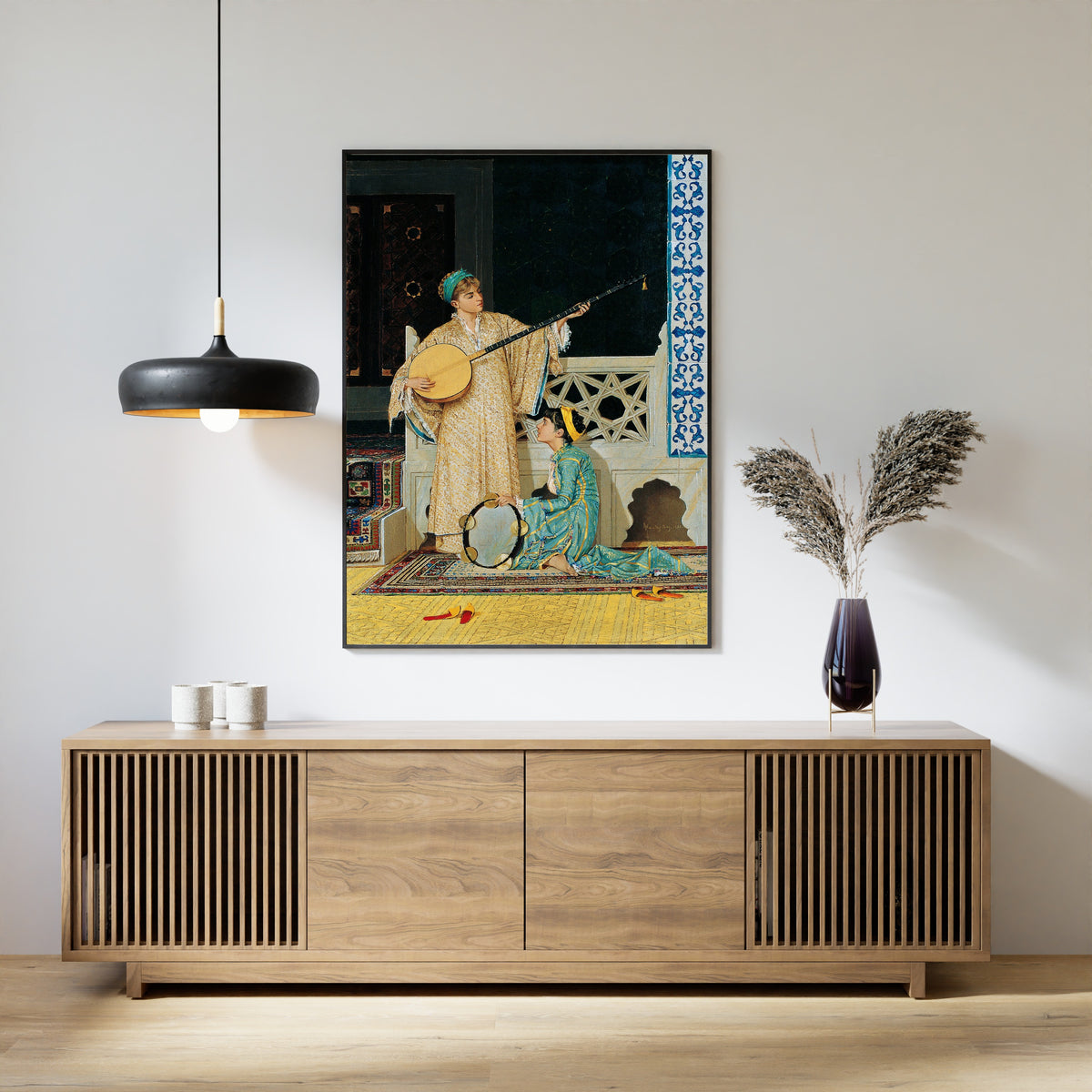 Two Musician Girls by Osman Hamdi Bey — framed above a slatted wood sideboard