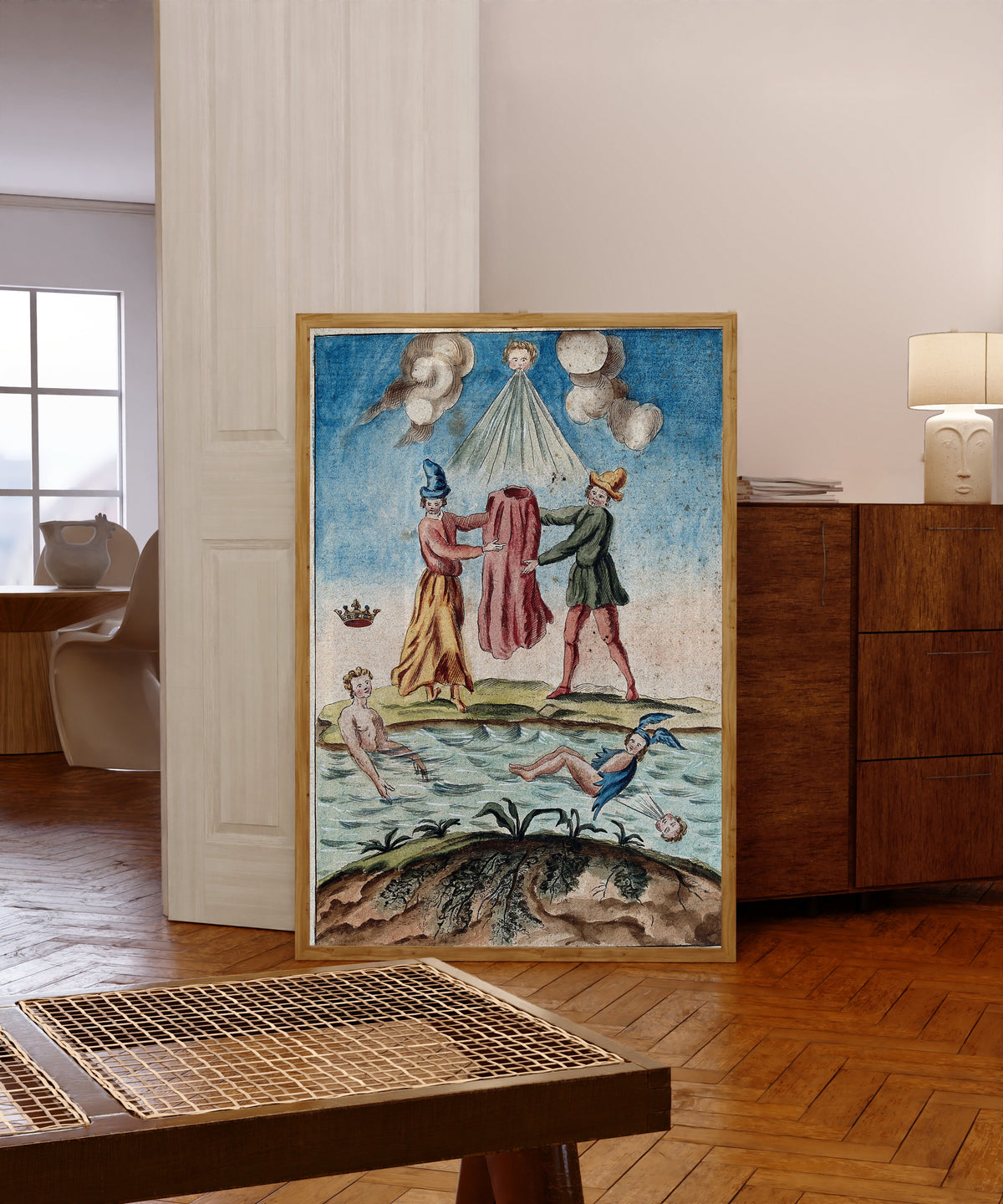 Framed art print of Two Peasants Holding a Red Robe, with Mercury… by After Nicolas Flamel, in a light wood frame leaning in a warm room with a parquet floor