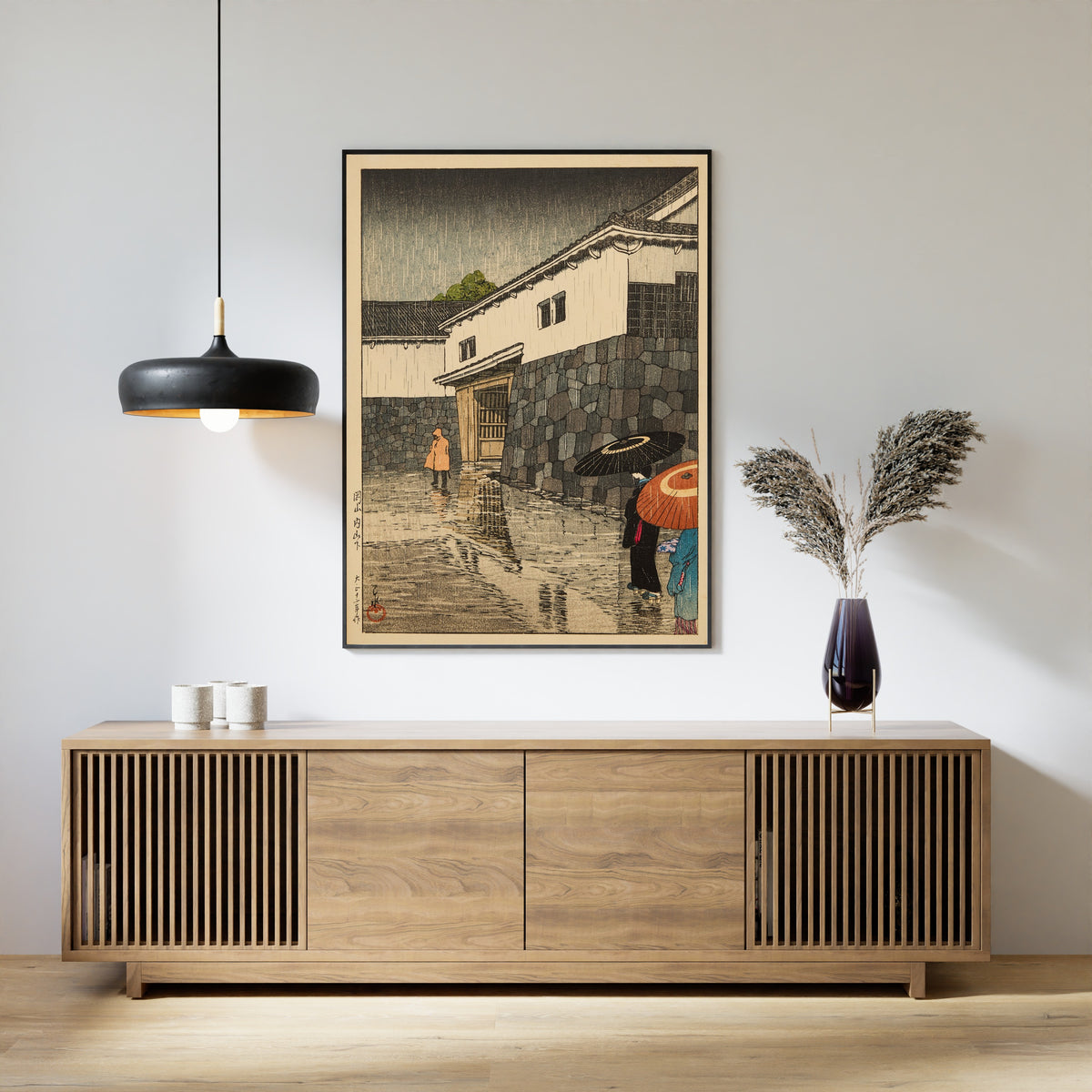 Framed art print of Uchiyamashita, Okayama by Kawase Hasui, above a slatted wood sideboard