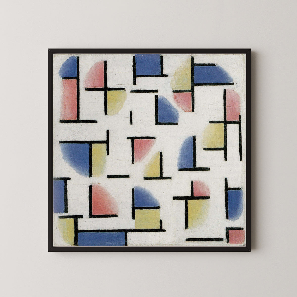 Framed art print of Variation on Composition XIII by Theo van Doesburg, in a black frame on a pale wall