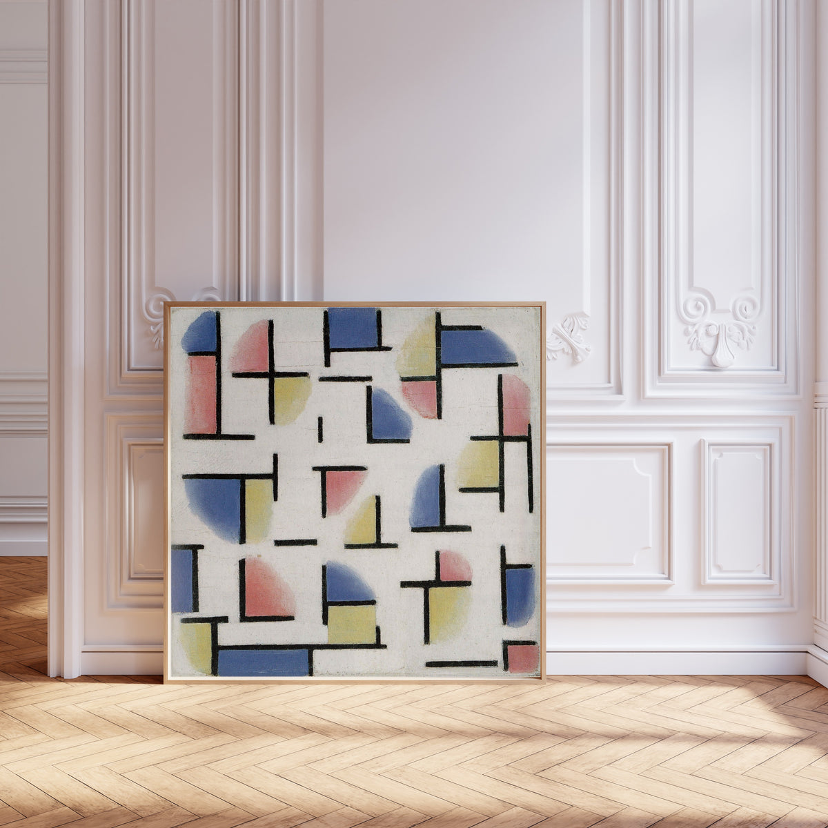 Framed art print of Variation on Composition XIII by Theo van Doesburg, leaning against pale pink panelling on a herringbone floor