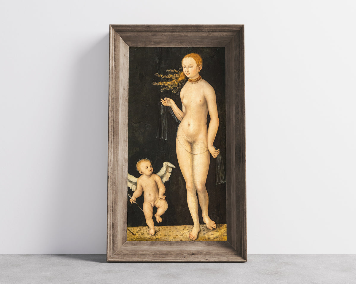 Framed art print of Venus and Cupid by Lucas Cranach the Elder, in a wide wooden frame leaning against a concrete wall