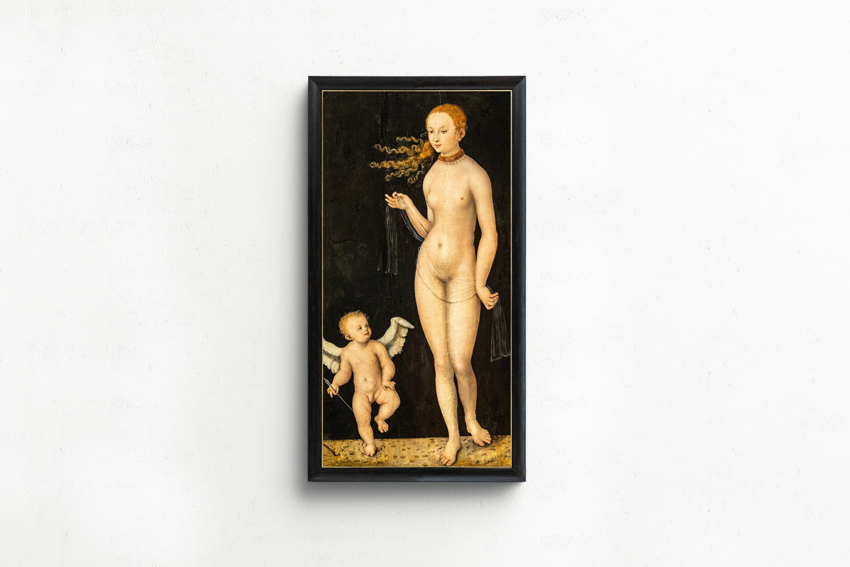 Framed art print of Venus and Cupid by Lucas Cranach the Elder, in a slim black frame on a plain white wall