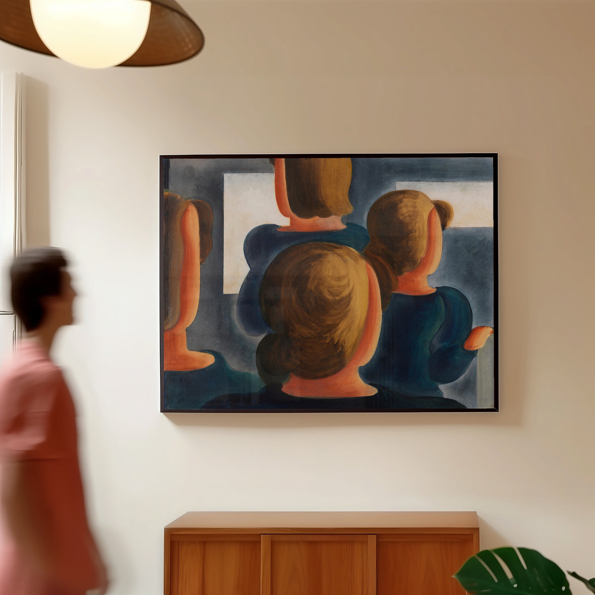 Framed art print of Vierergruppe mit Grau by Oskar Schlemmer, in a slim black frame on a warm wall in a sunlit room